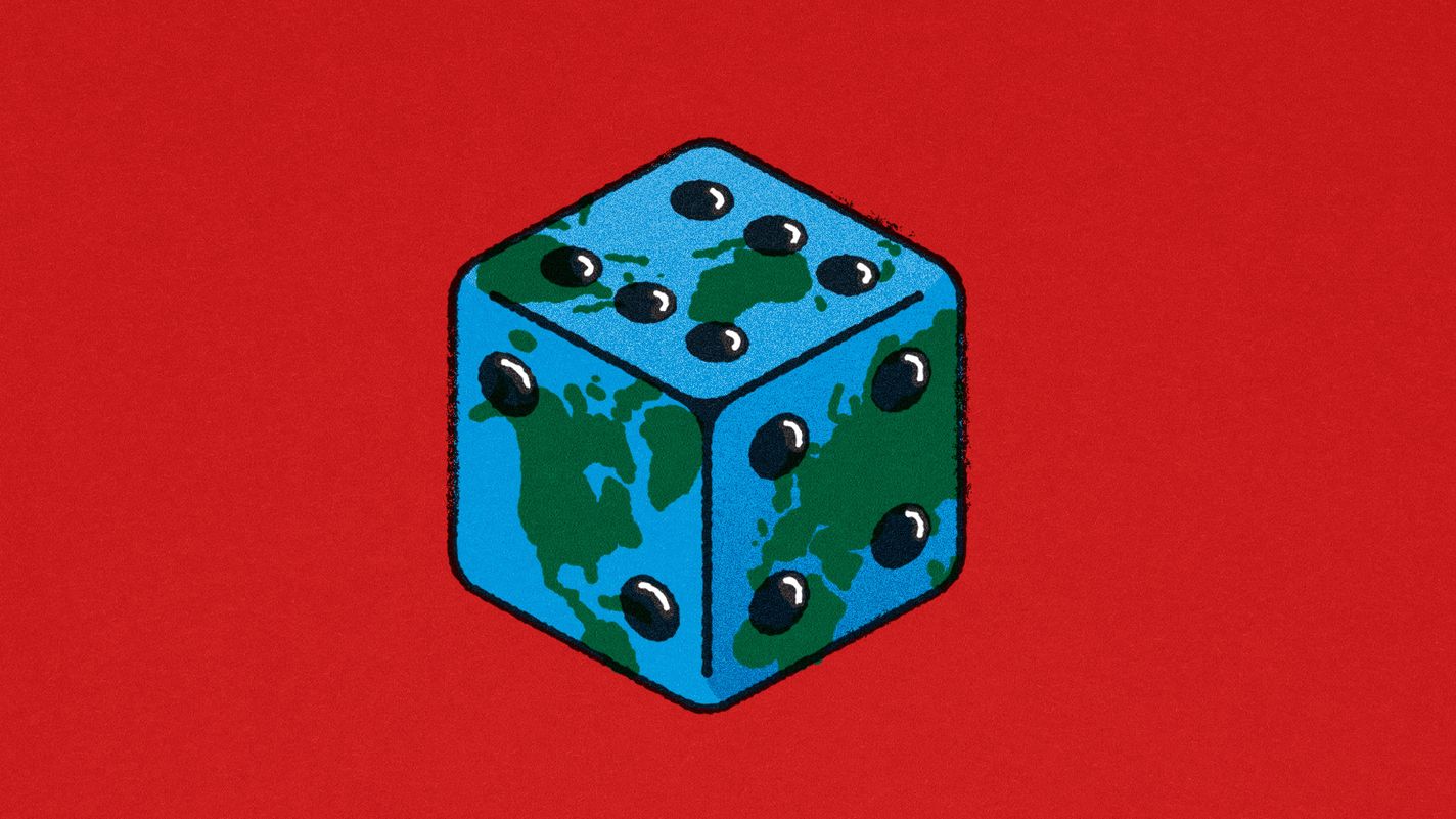 A playing dice with the world map printed on its sides