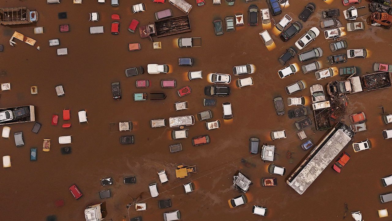 Aerial shot showing cars submerged in flood water caused by heavy rains in Rio Grande do Sul, Brazil.