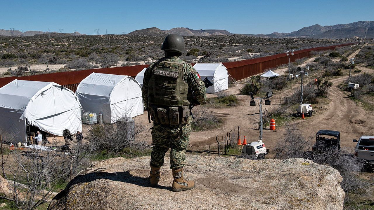 A Mexican soldier guarding a camp near the border in Rancho San Judas, Mexico.