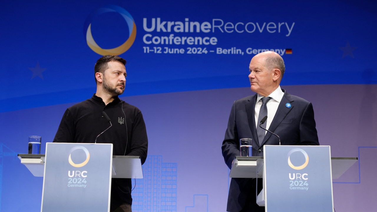 German Chancellor Olaf Scholz and Ukrainian President Volodymyr Zelensky give a joint press conference during the Ukraine Recovery Conference in Berlin