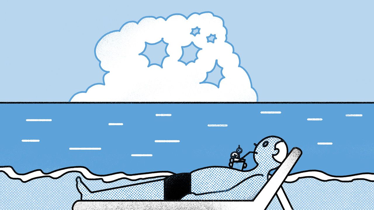 A man relaxes on a sunbed in front of the sea whist sipping a cocktail. A cloud which resembles a screaming person looms on the horizon.