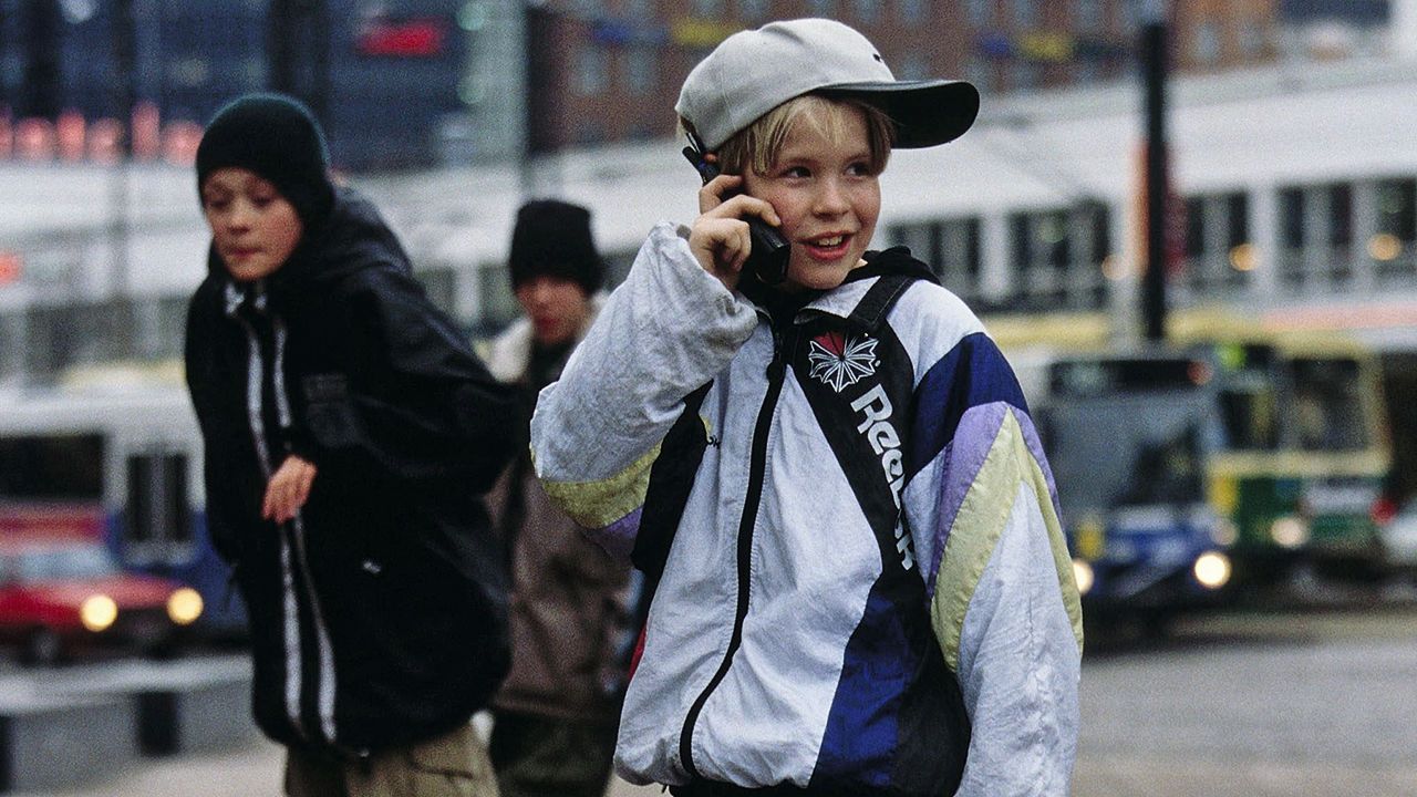 Kid with Cell Phone. 1990s.
