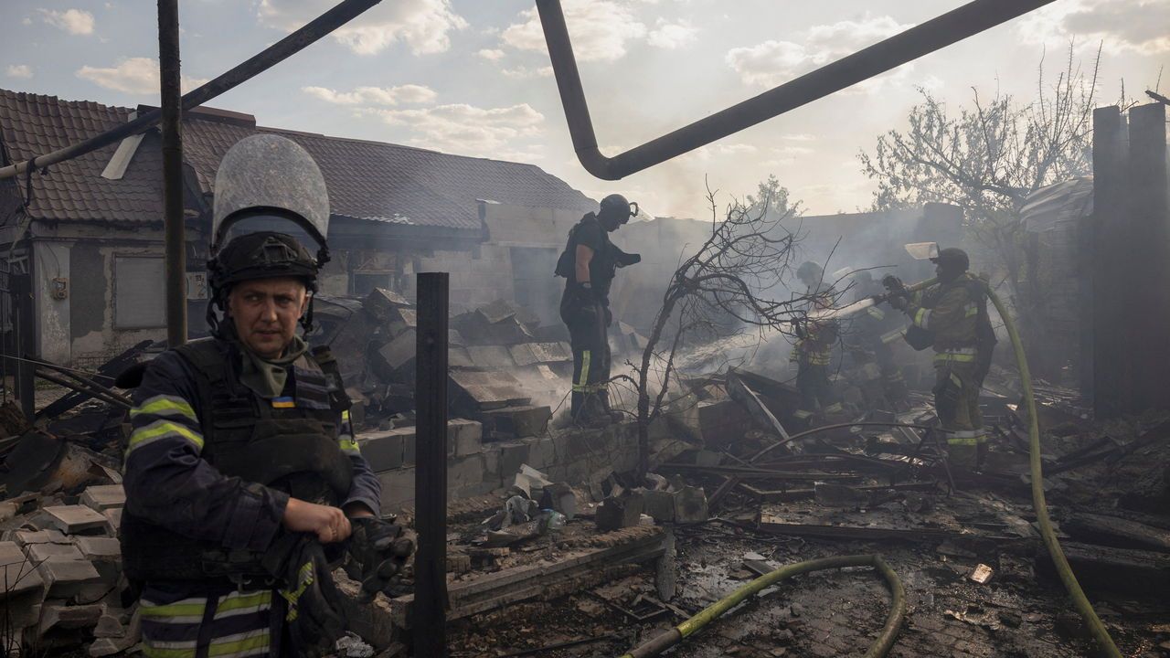 Emergency workers extinguish a fire that destroyed a private house after a Russian strike in Pokrovsk